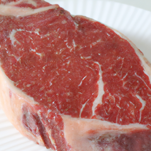 A beautifully seasoned raw steak ready to be cooked